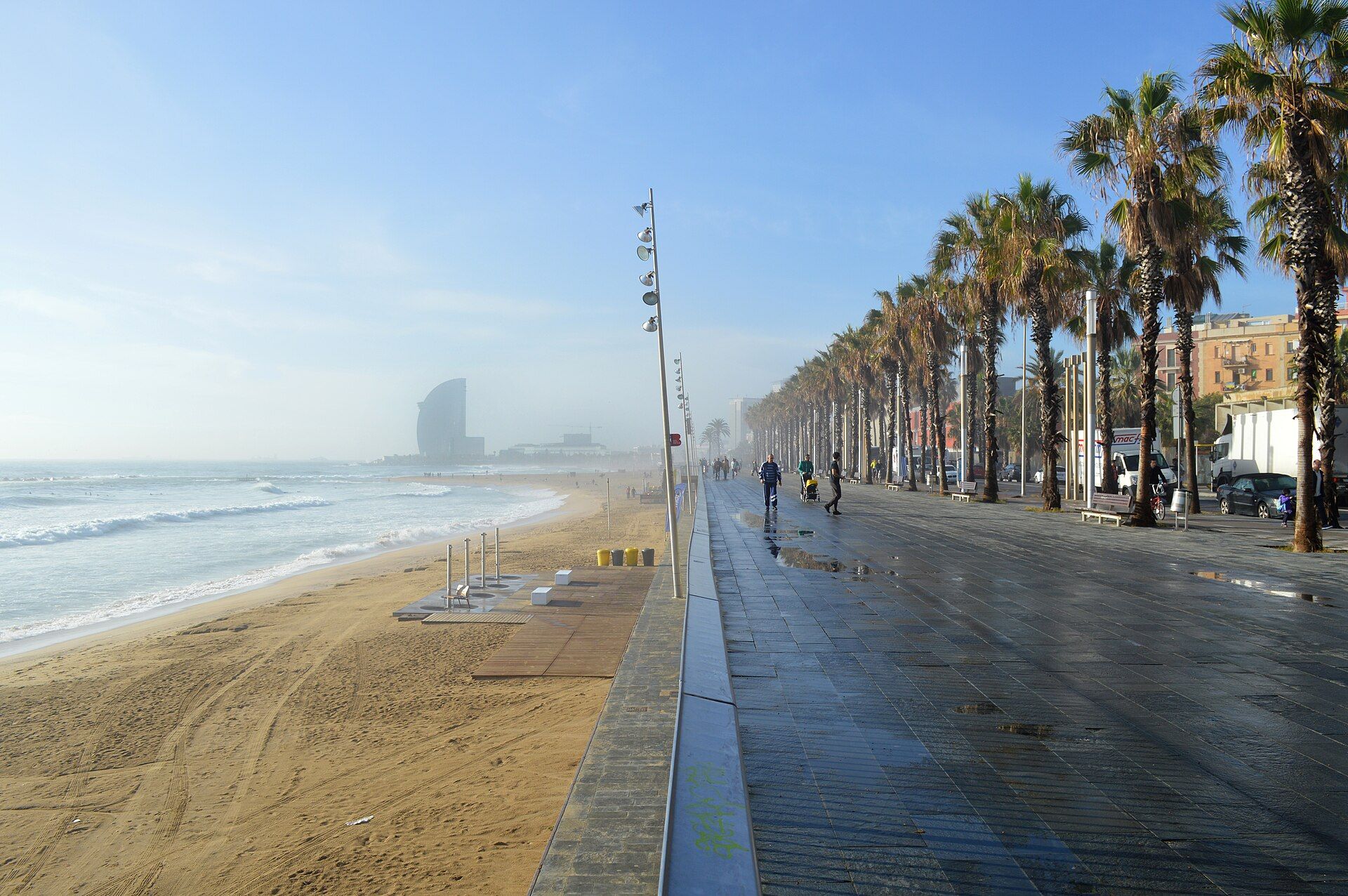 The wide seafront promenade and beach at Barceloneta, Barcelona