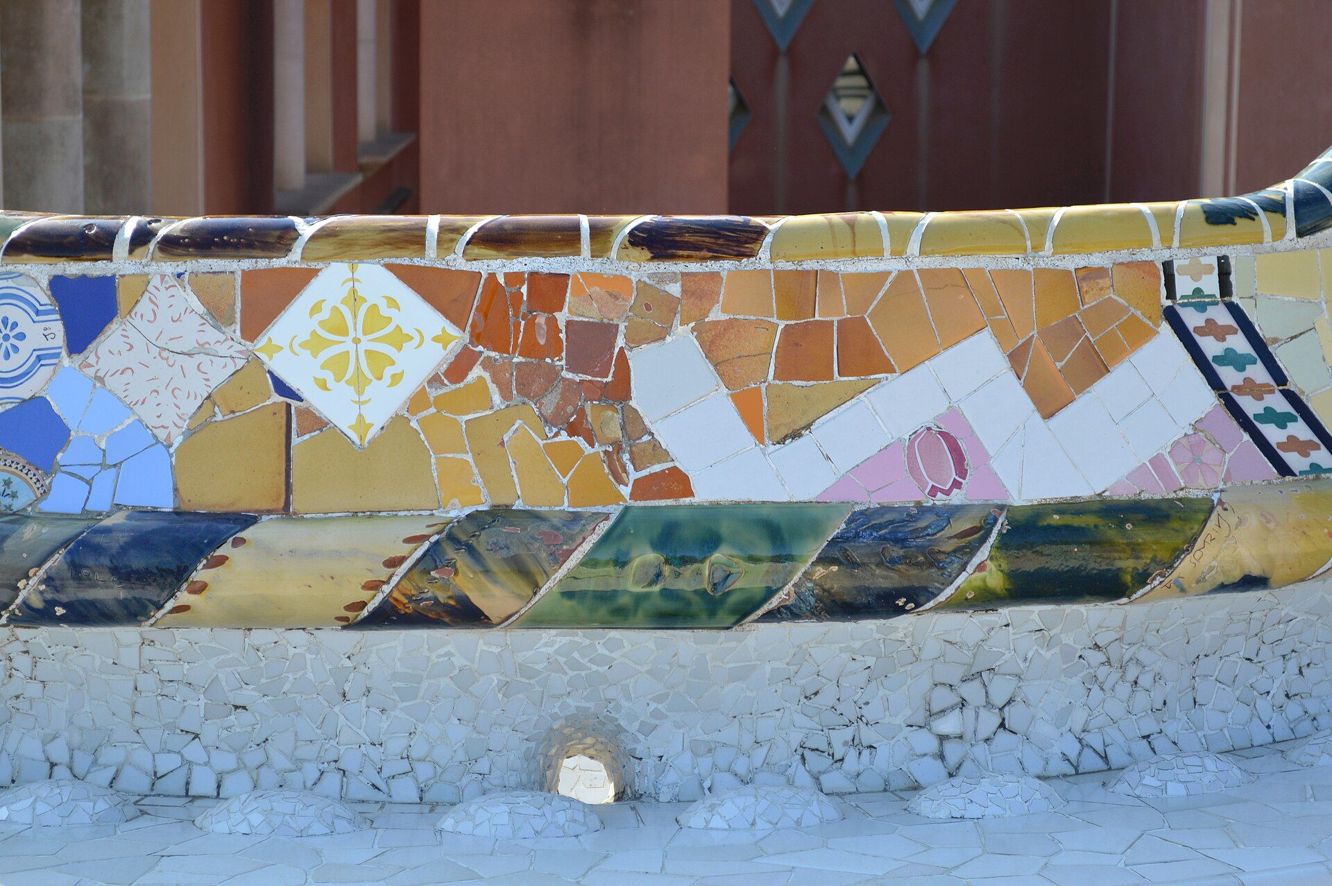 Trencadis mosaic benches winding around the main terrace at Park Guell, Barcelona